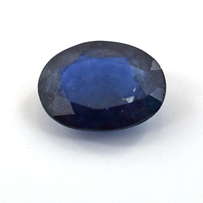 Oval-cut blue gemstone with a deep, rich color.