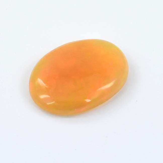 Oval-shaped orange gemstone with a smooth, polished surface.