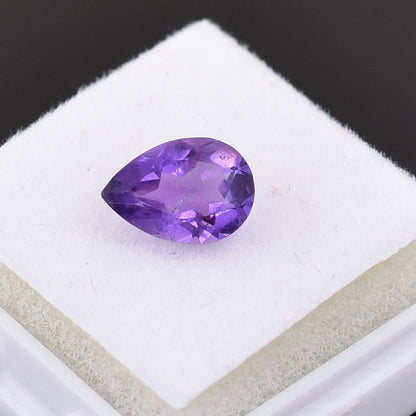 Pear-shaped purple gemstone, likely an amethyst.