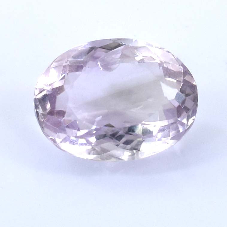 Oval-cut pale purple gemstone with facets.