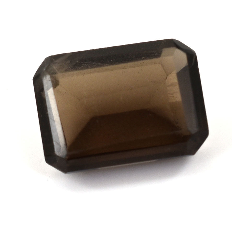 Rectangular-cut smoky quartz gemstone with faceted edges.