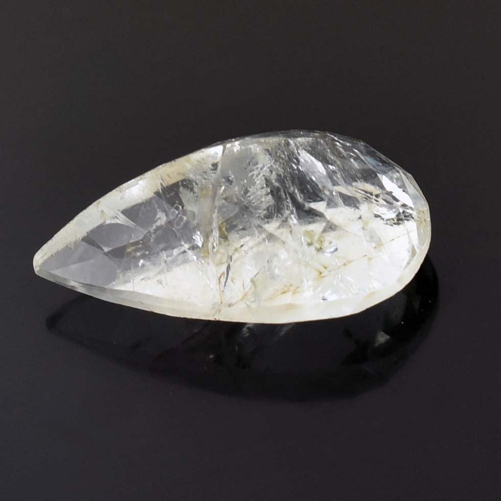 Teardrop-shaped clear crystal or gemstone with internal inclusions.