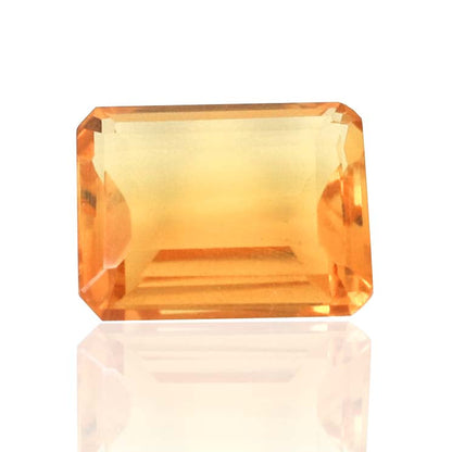 Emerald-cut citrine gemstone with a warm orange-yellow hue.