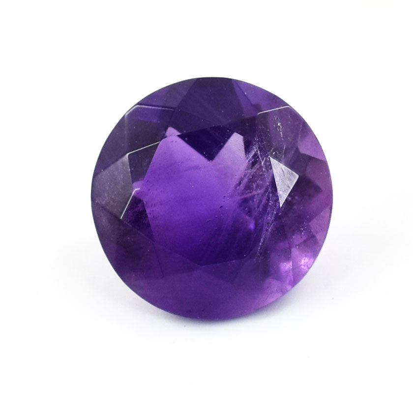 Round-cut purple gemstone, likely an amethyst.