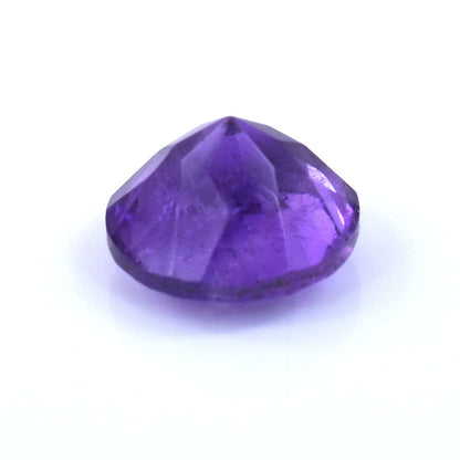 Faceted purple gemstone with a round brilliant cut.