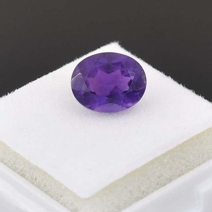 Oval-cut purple gemstone, likely an amethyst.