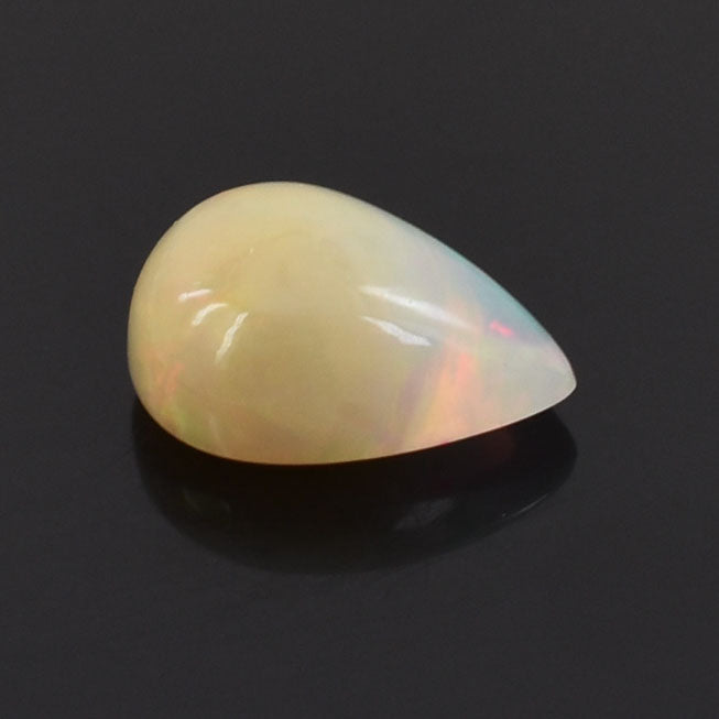 Teardrop-shaped opal gemstone with a pearlescent sheen.