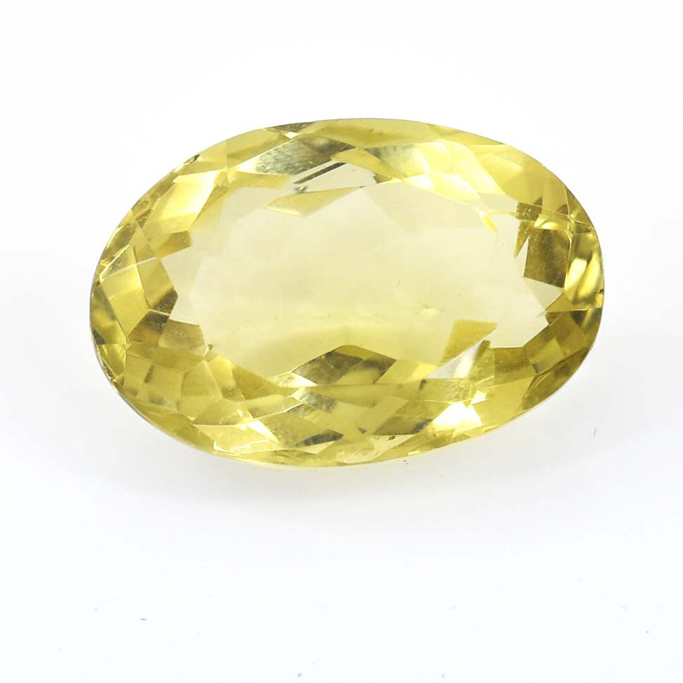 Oval-cut yellow gemstone with facets reflecting light.