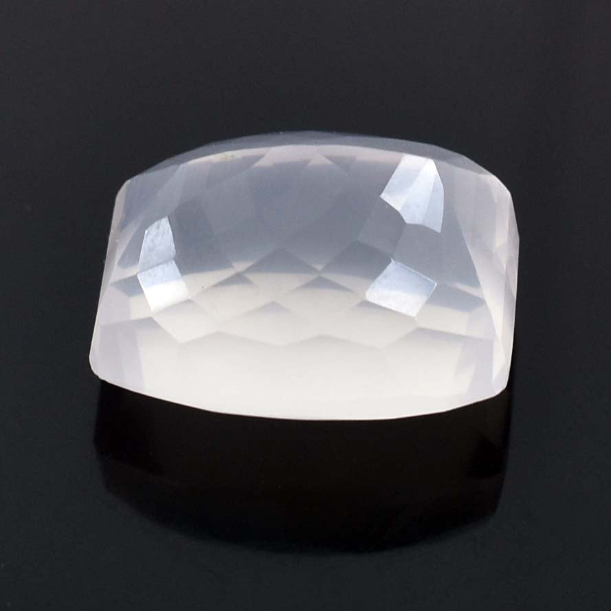 Translucent white gemstone or crystal with faceted top surface.