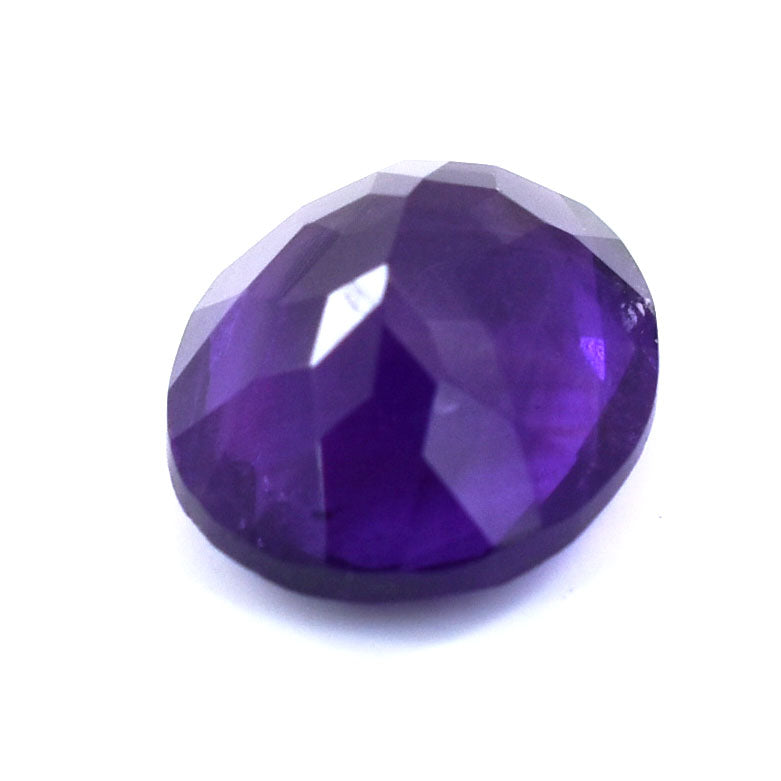 Faceted purple gemstone with a deep, rich color.