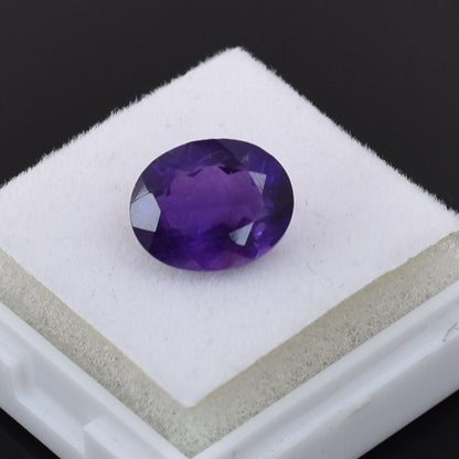 Oval-cut purple gemstone, likely an amethyst.