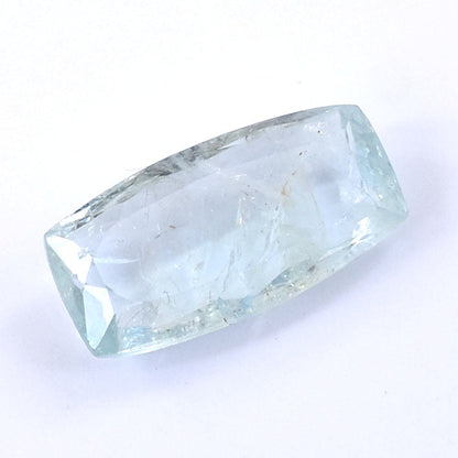 Pale blue, translucent crystal or gemstone with a faceted, elongated shape.