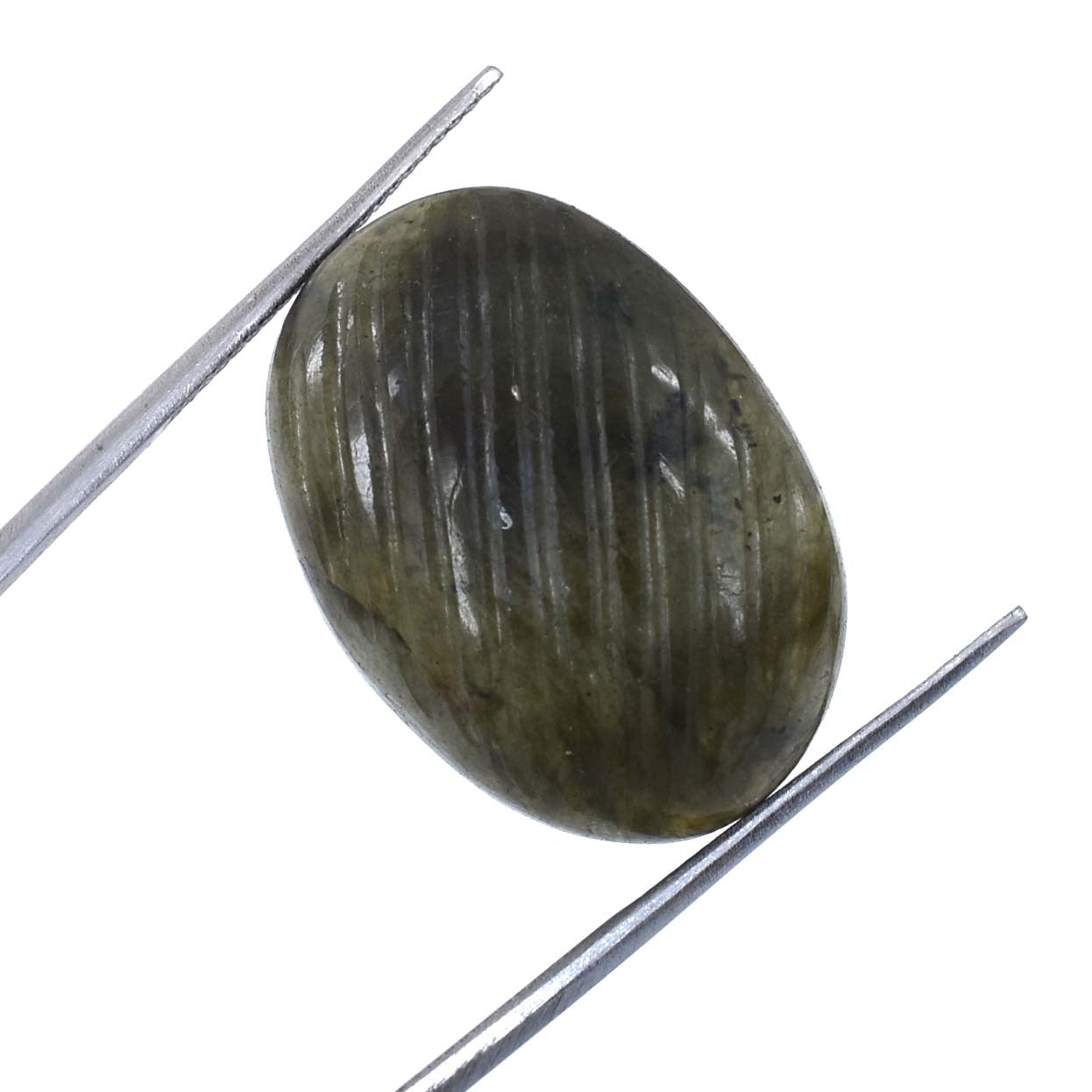 Oval-shaped, dark green gemstone with striations held between tweezers.