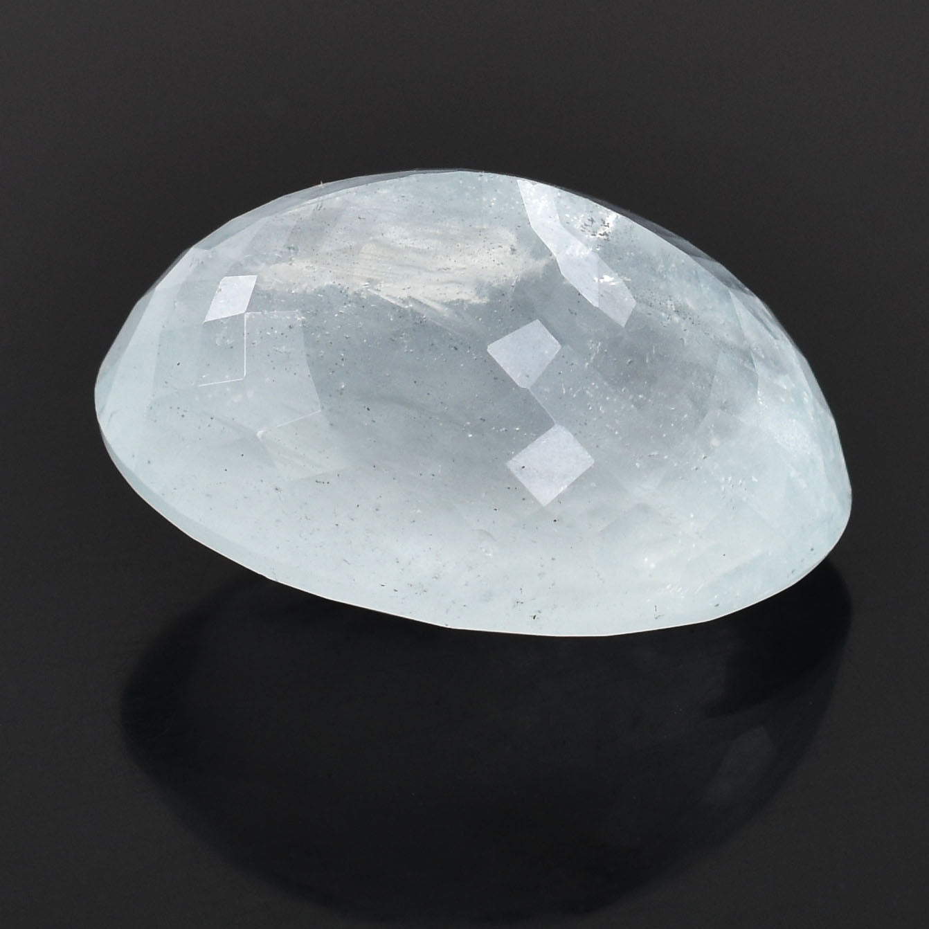 Smooth, oval-shaped moonstone gemstone with a pearly white luster.