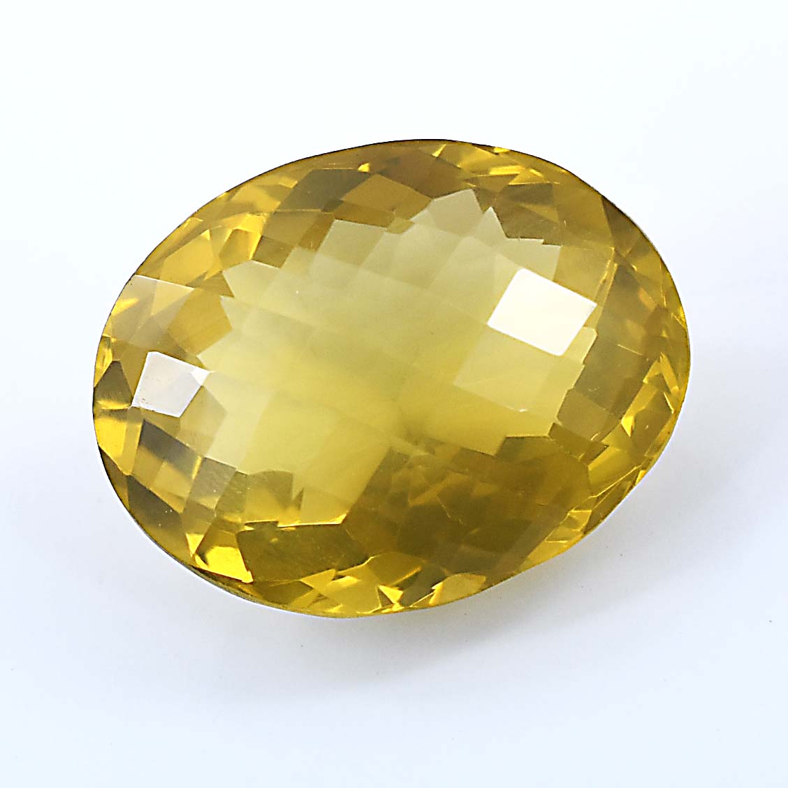 Faceted oval-shaped yellow gemstone with a brilliant cut.