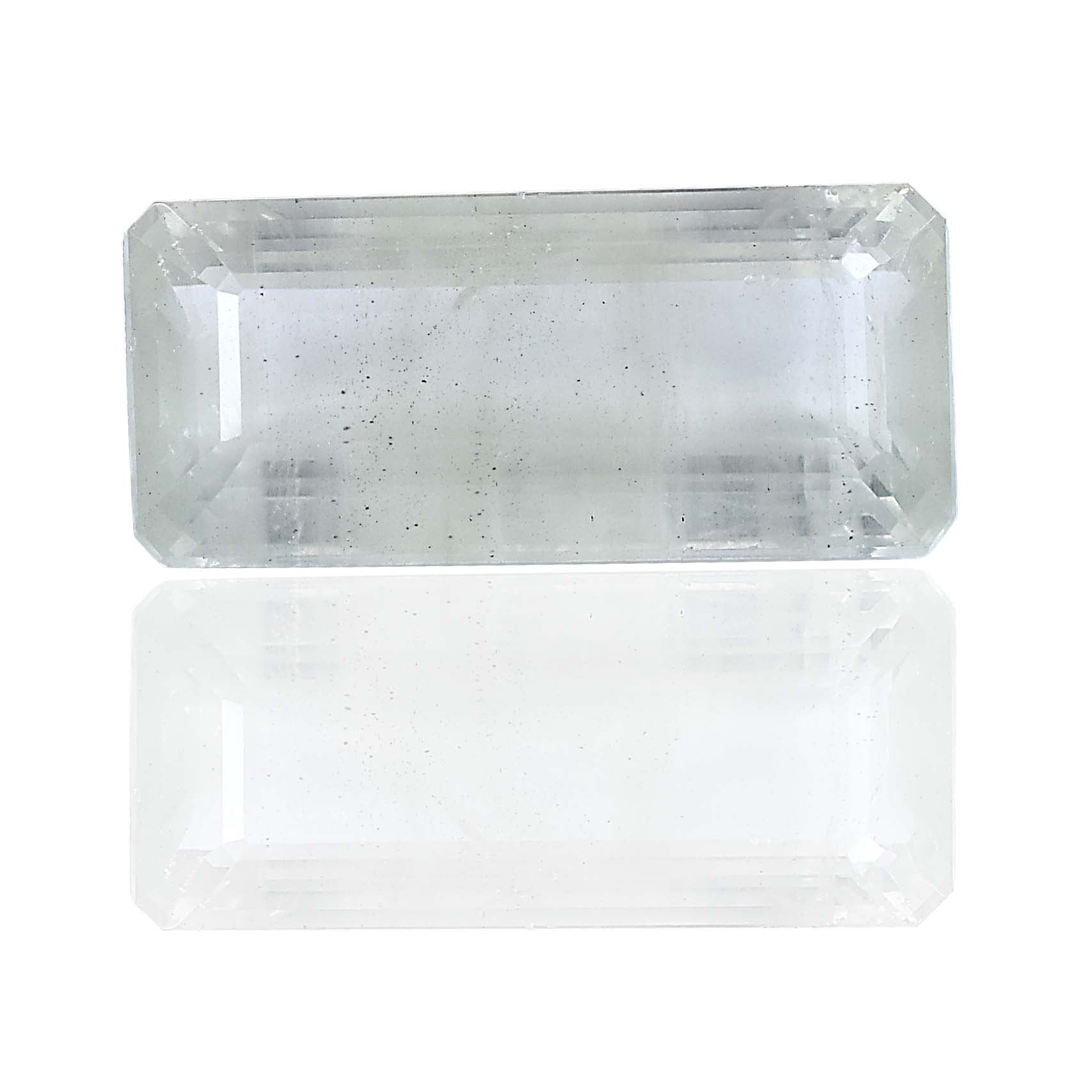 Rectangular cut transparent gemstone or crystal with a flat top surface.