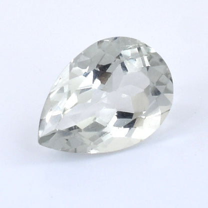 Pear-shaped clear gemstone with faceted cuts.