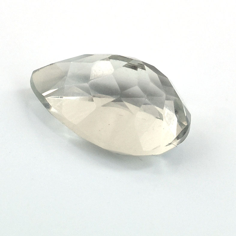 Faceted clear gemstone or crystal with an oval shape.