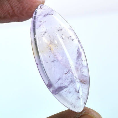 Oval-shaped, translucent gemstone with a pale purple hue, likely amethyst.