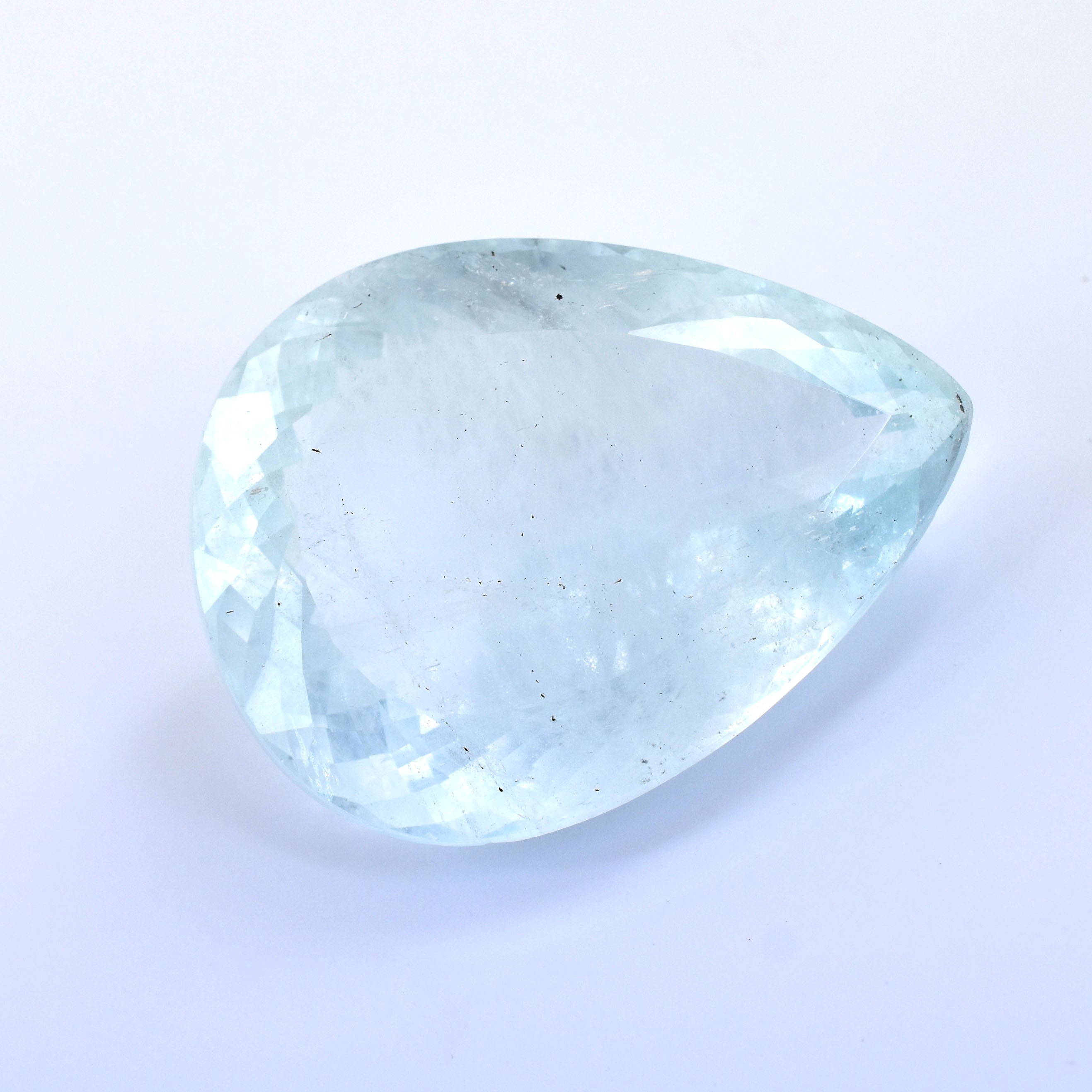 Pale blue, teardrop-shaped gemstone or crystal with a smooth, polished surface.