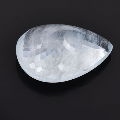 Teardrop-shaped, translucent crystal or gemstone with a smooth, polished surface.