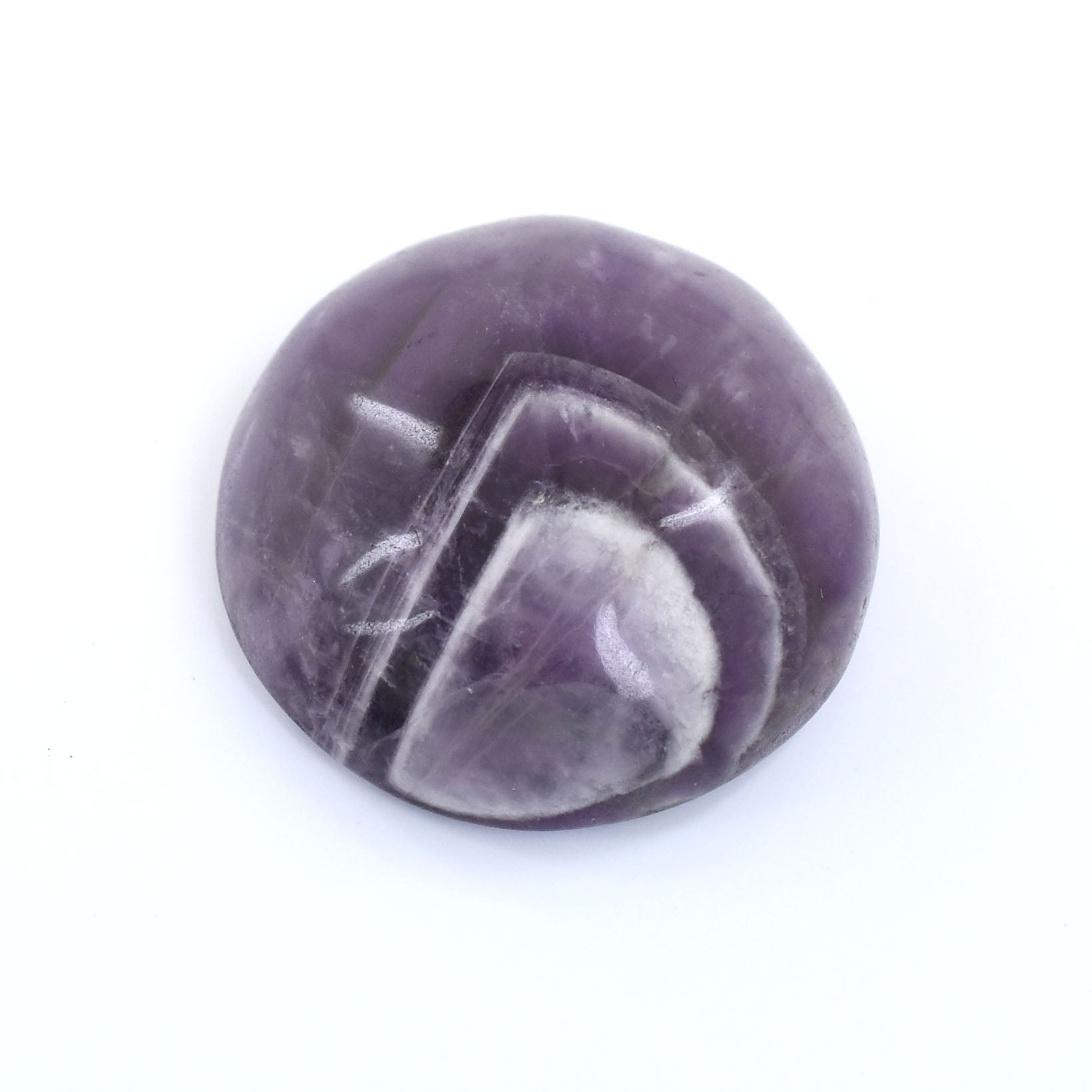 Smooth, polished purple stone or crystal with white striations.