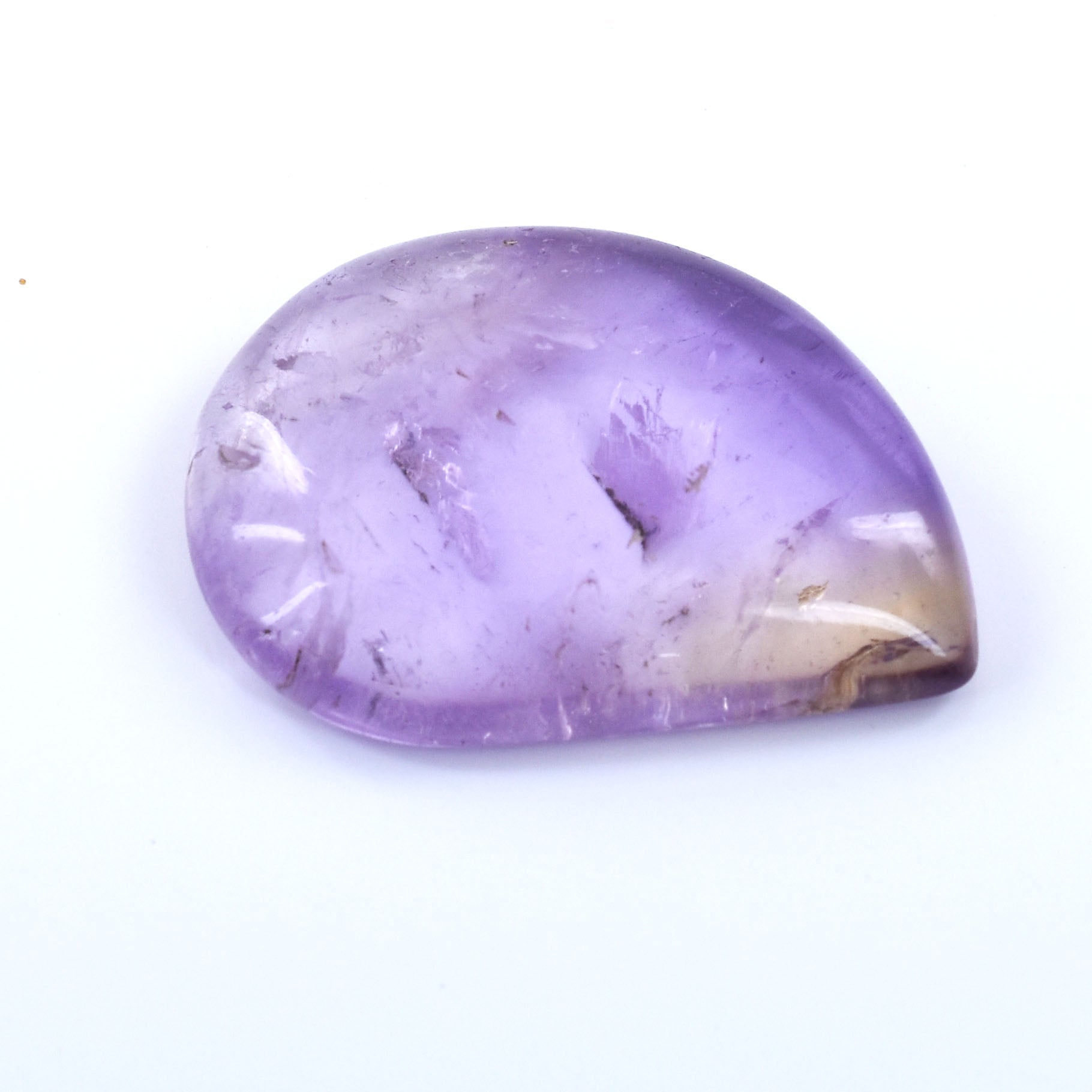 Teardrop-shaped purple gemstone with some white inclusions.