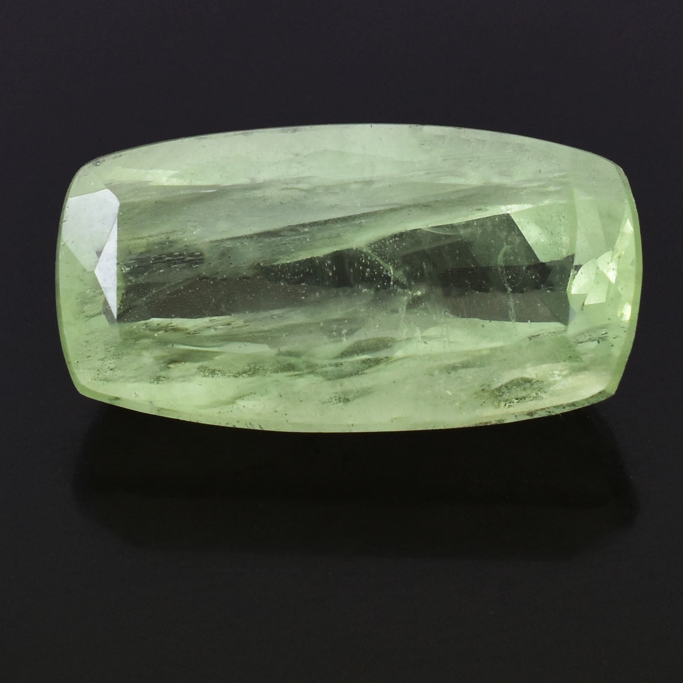 Pale green gemstone with a rectangular cushion cut.