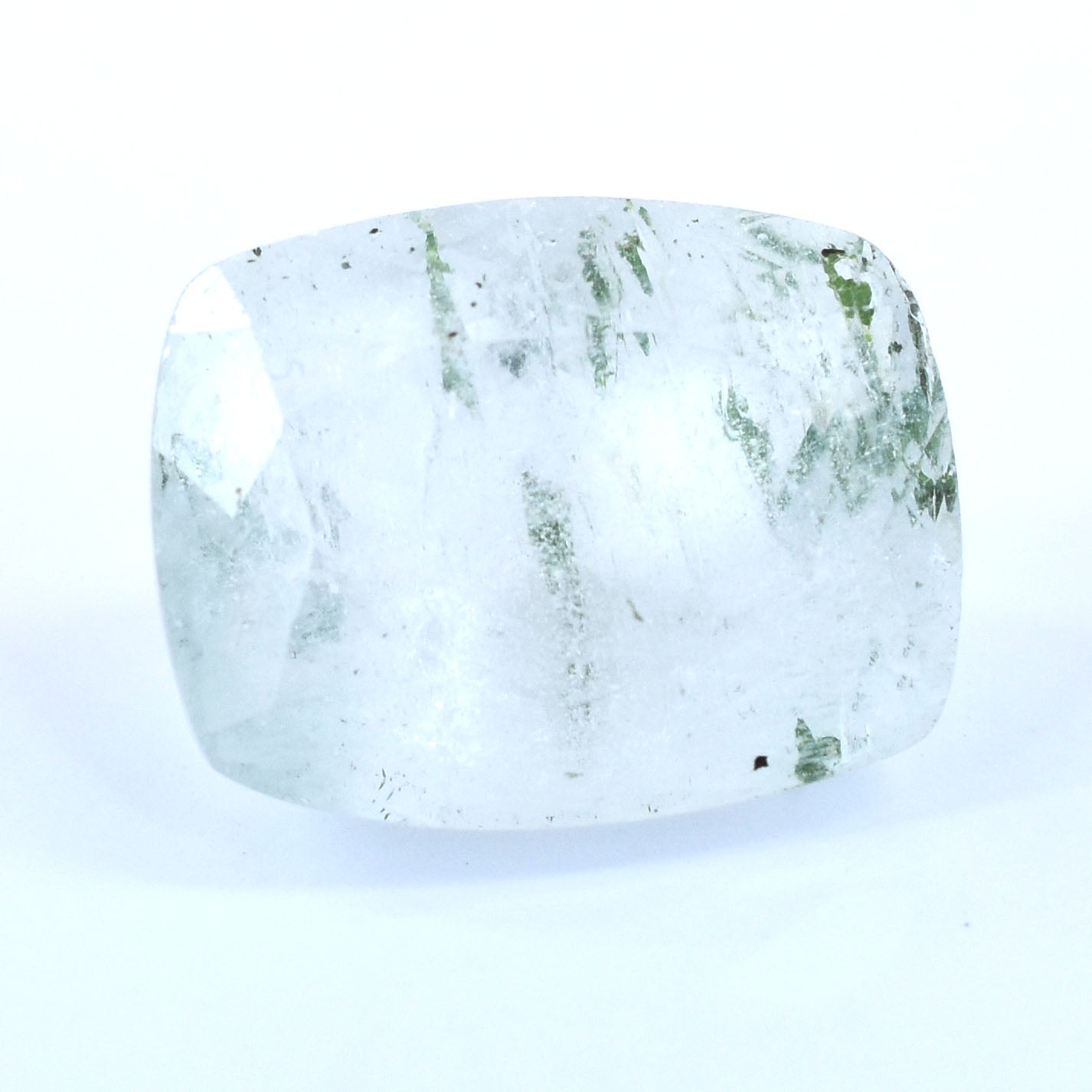 Translucent quartz crystal with green inclusions.