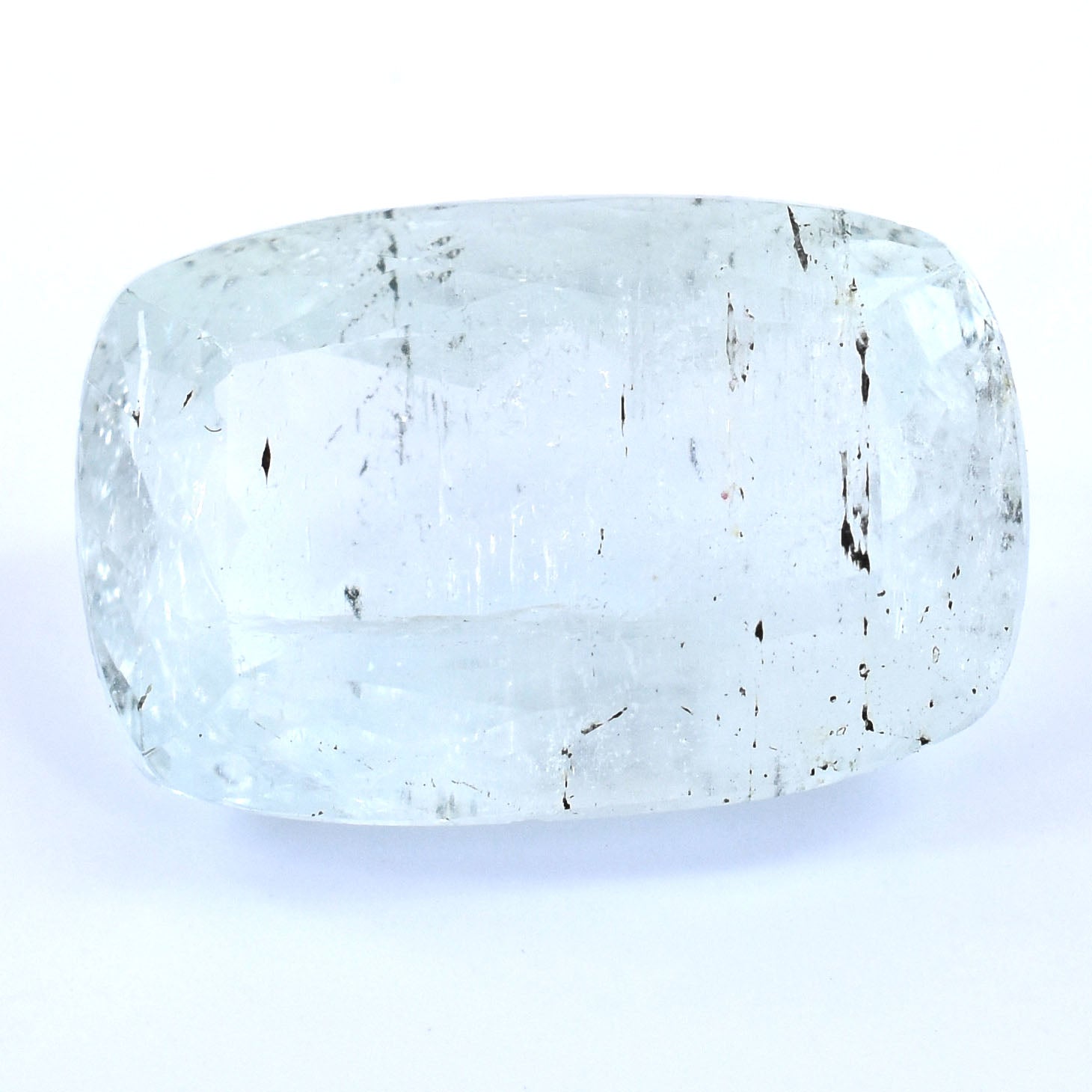 Translucent, rounded rectangular gemstone with visible internal inclusions.