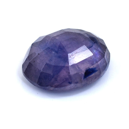 Faceted purple gemstone with a deep violet hue.