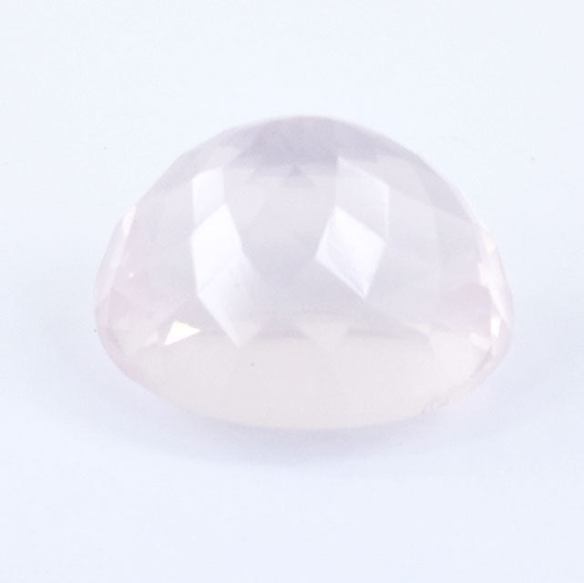 Pale pink, translucent gemstone with a smooth, rounded cabochon cut.