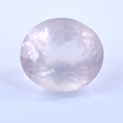 Oval-shaped, pale pink gemstone with a smooth, polished surface.