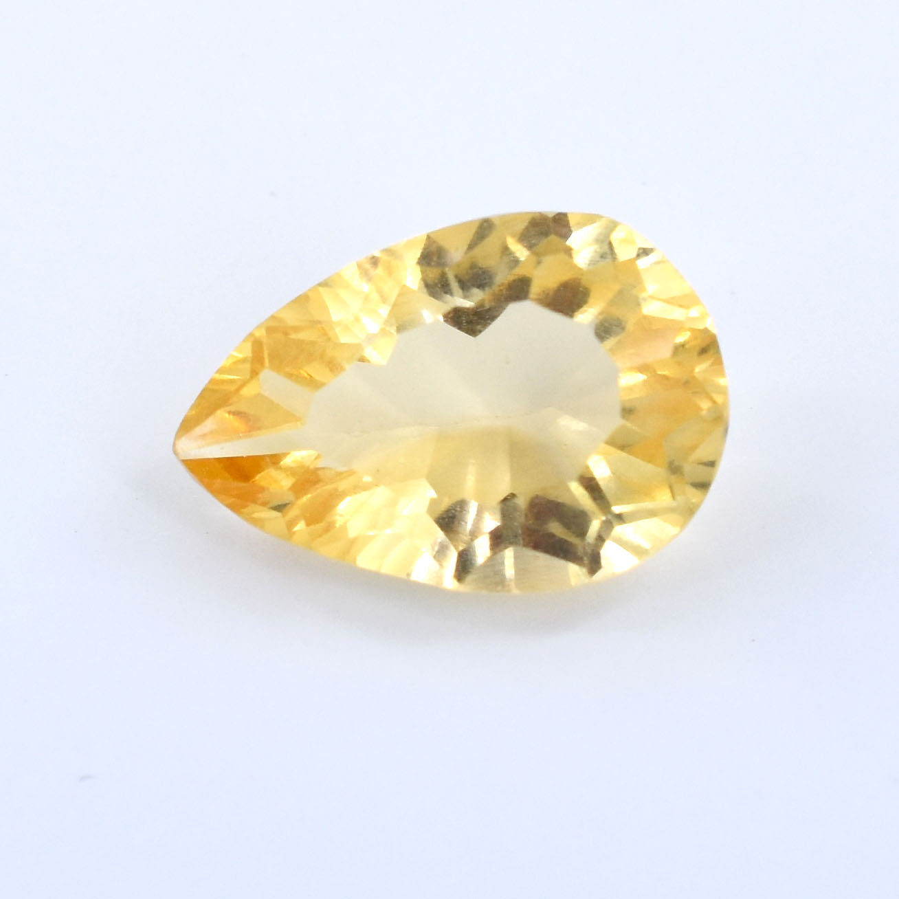 Pear-shaped yellow gemstone, likely a citrine or topaz.