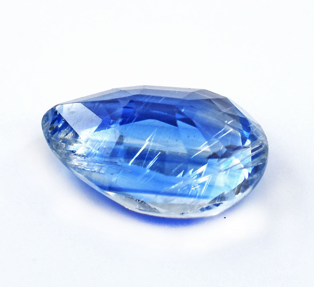 Faceted blue gemstone with a teardrop shape.