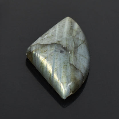 Polished labradorite gemstone with iridescent sheen.