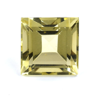 Square-cut yellow gemstone with faceted edges.