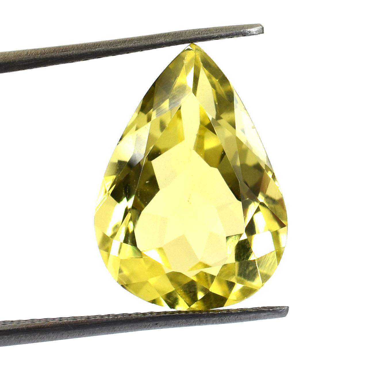 Pear-shaped yellow gemstone held by tweezers.