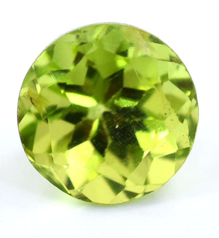 Round-cut peridot gemstone with a vibrant lime-green color.