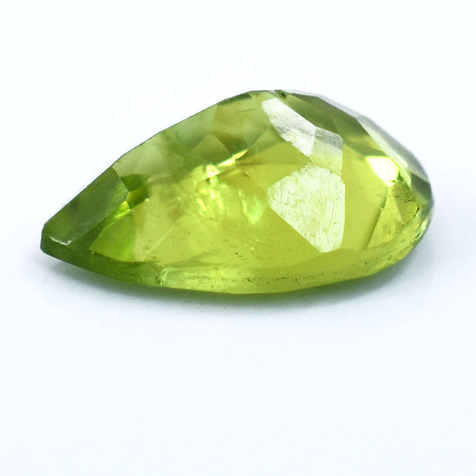 Teardrop-shaped peridot gemstone with faceted cut.