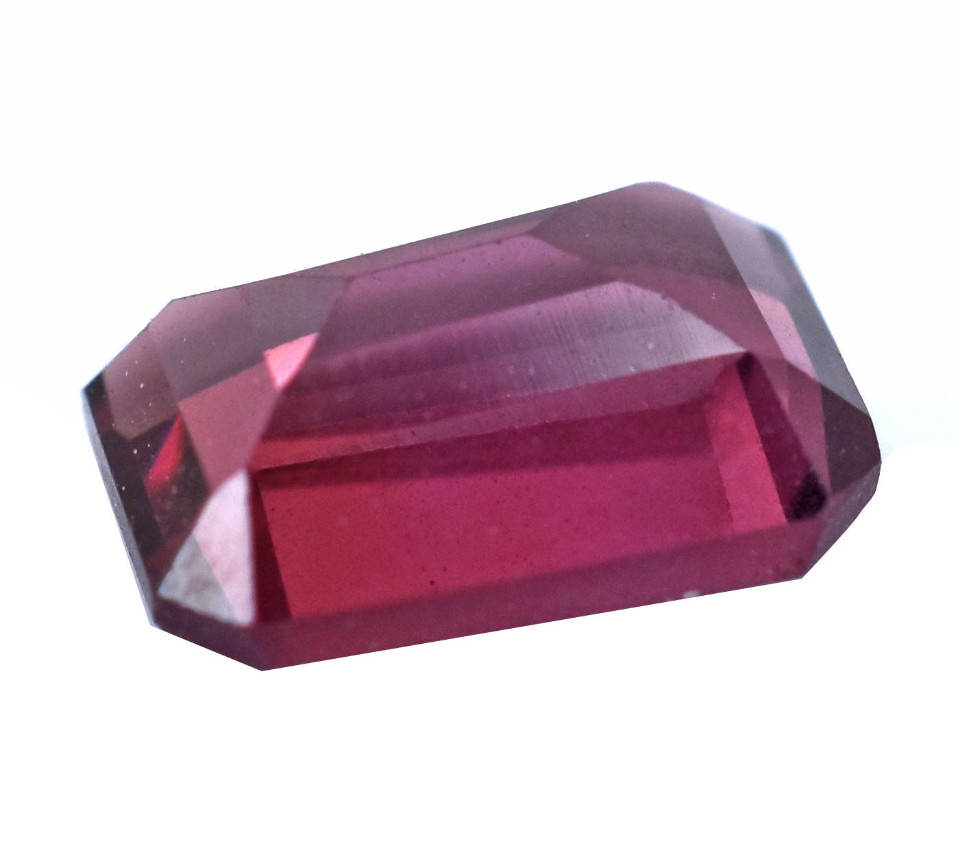 Faceted ruby gemstone with a deep red color.