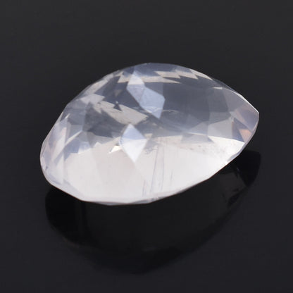 Faceted oval gemstone or crystal with a translucent white appearance.