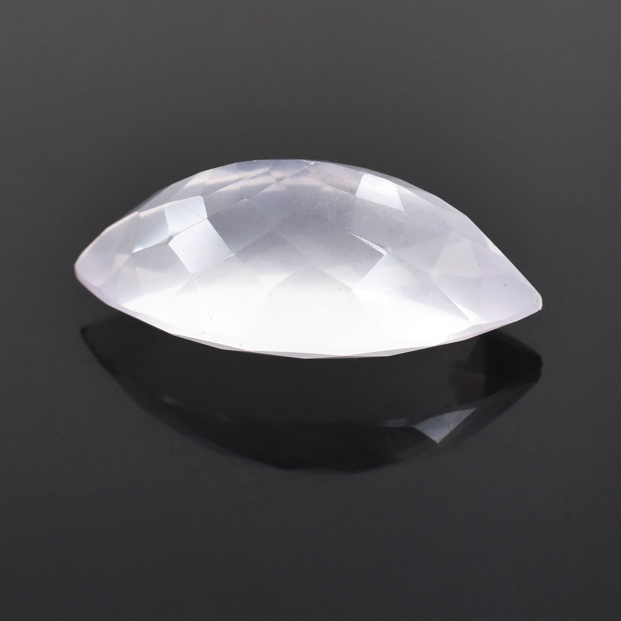 Faceted white gemstone with a marquise cut shape.