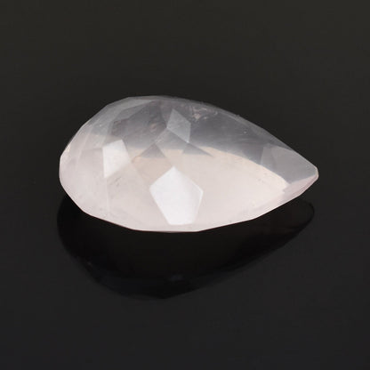 Teardrop-shaped white gemstone or crystal with a faceted surface.