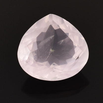 Pear-shaped, translucent gemstone with a faint pink hue.