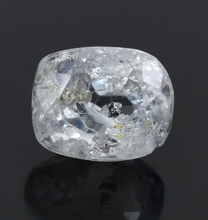 Cushion-cut diamond with visible inclusions and a slightly cloudy appearance.