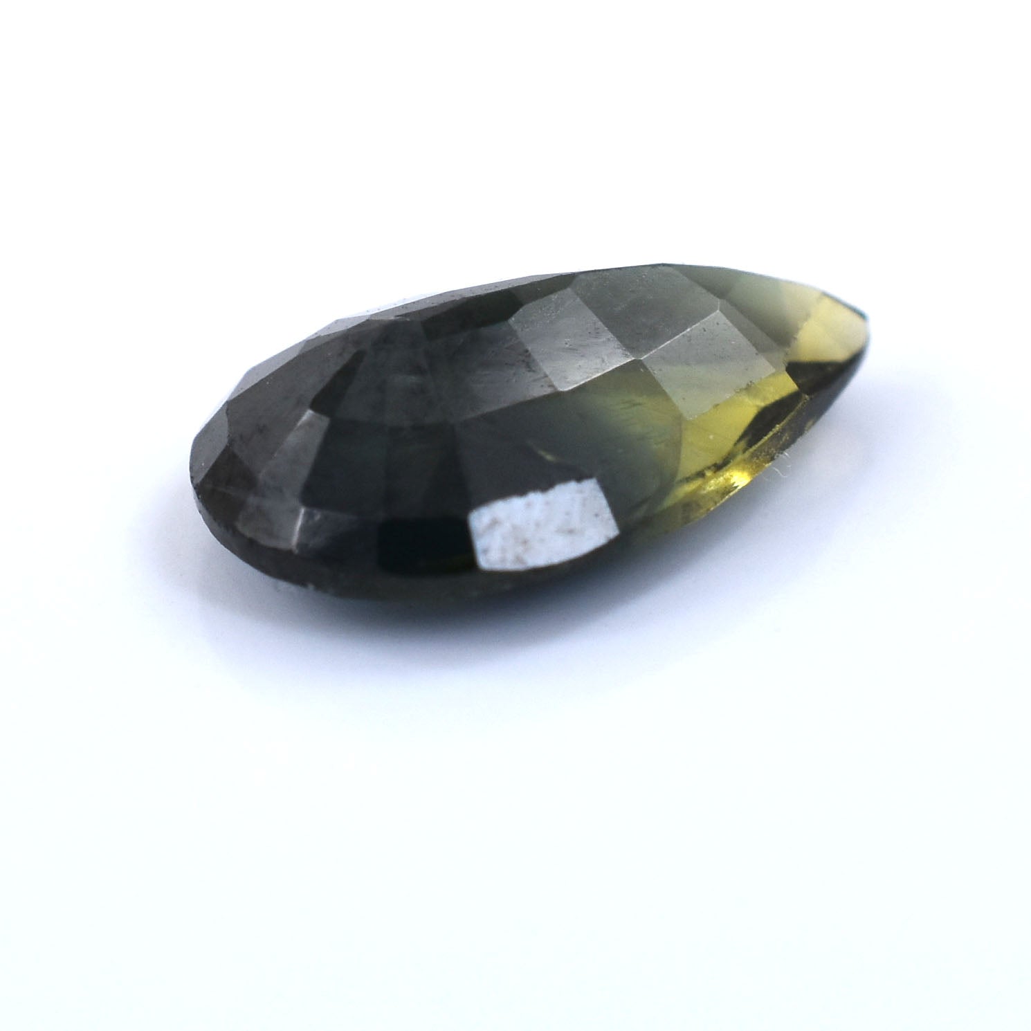 Faceted teardrop-shaped gemstone with dark green and yellow coloration.