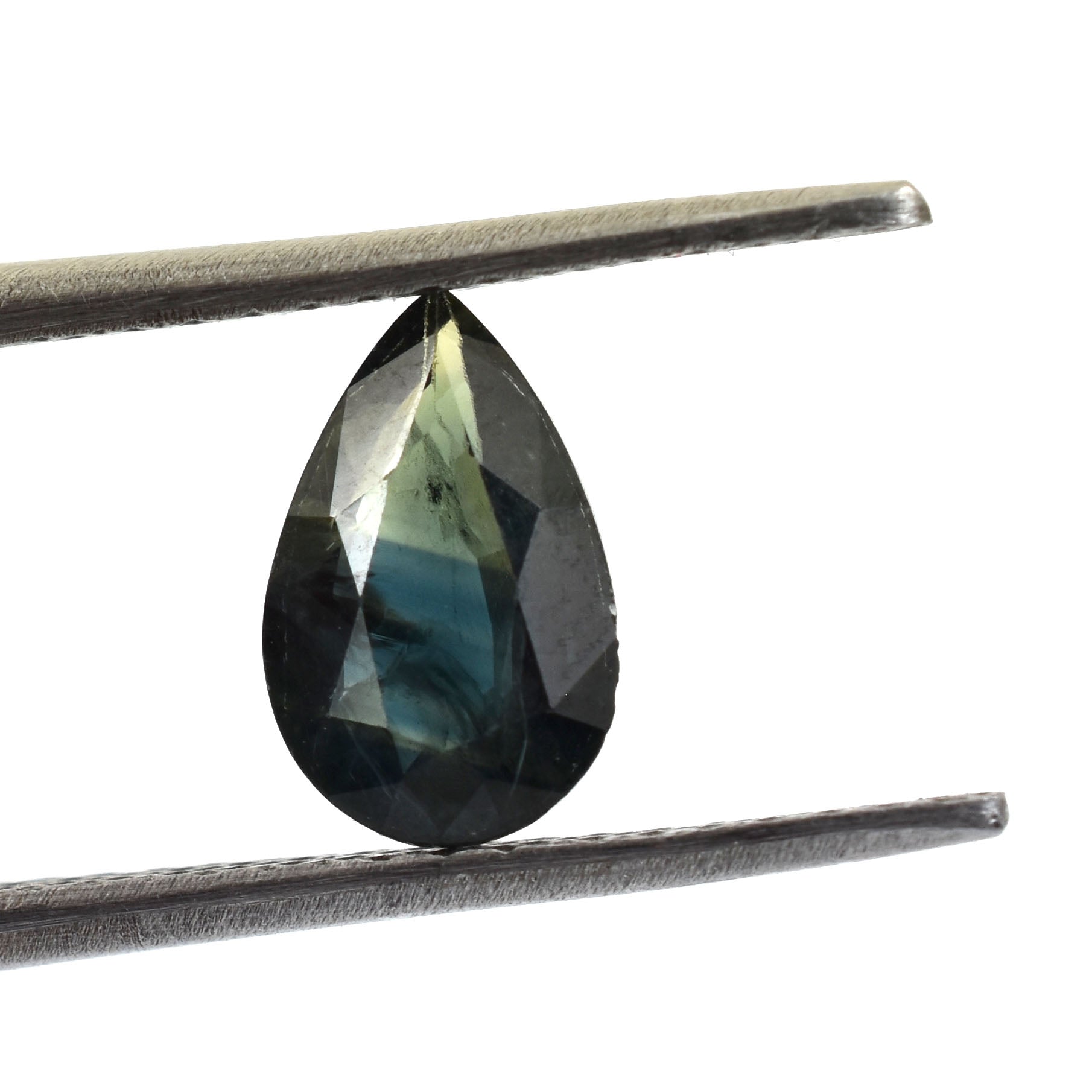 Teardrop-shaped gemstone with a dark blue-green color held by tweezers.