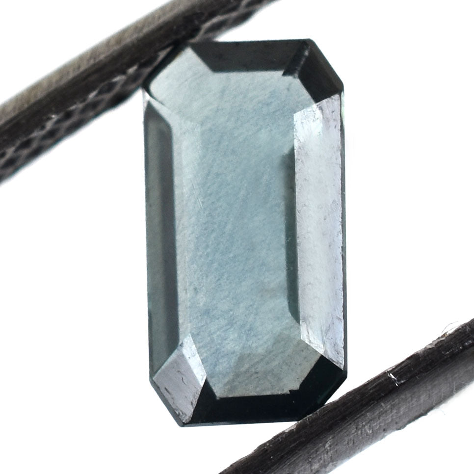 Emerald-cut gemstone with a pale blue-green color.