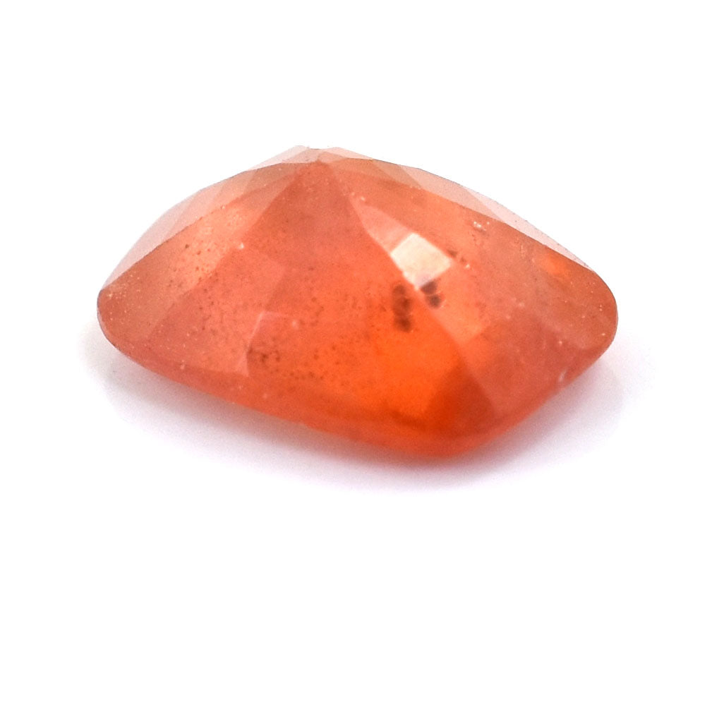 Orange gemstone with a faceted, cushion-cut shape.